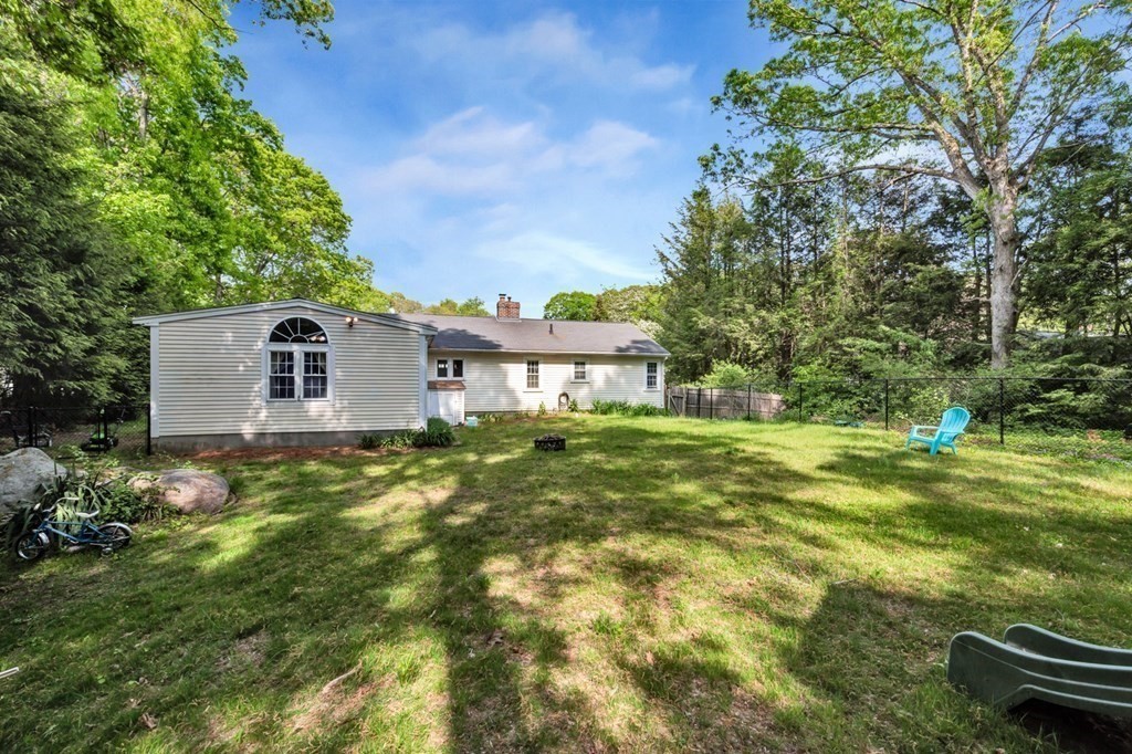 49 Woodland Road Ashland, MA 01721 - Photo 34 of 36 a view of a house with a yard