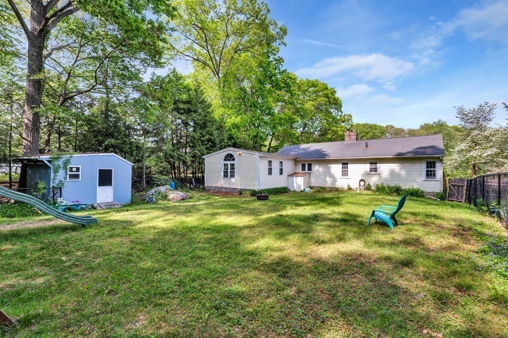 49 Woodland Road Ashland, MA 01721 - Photo 35 of 36 a house view with a sitting space and garden