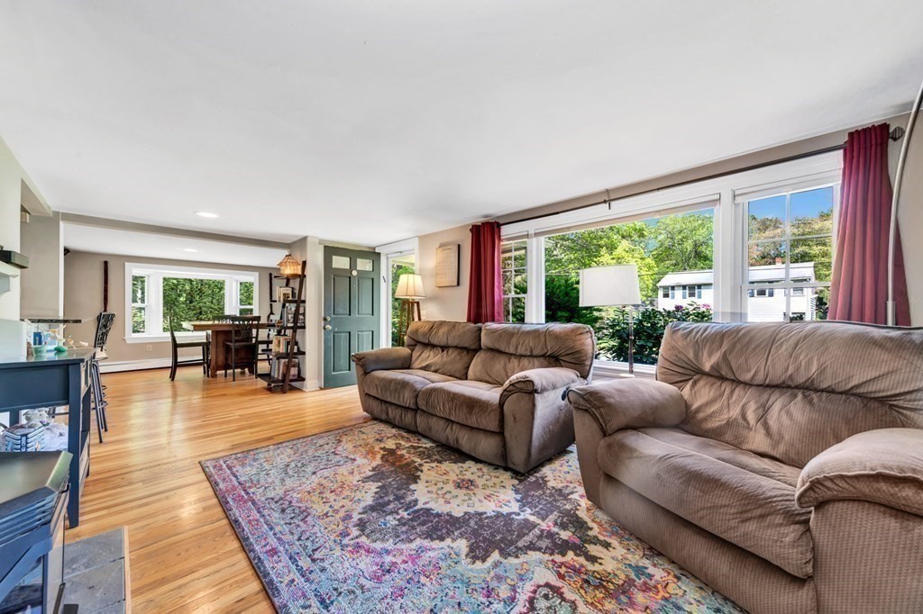 49 Woodland Road Ashland, MA 01721 - Photo 10 of 36 a living room with furniture and a large window