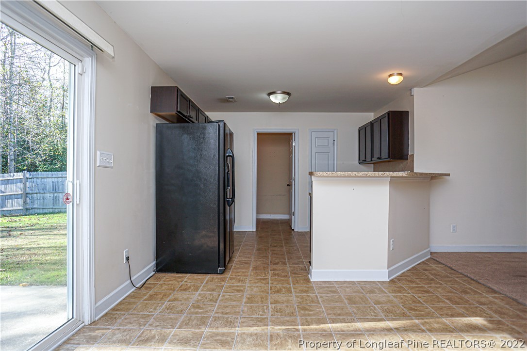 286 Cape Fear Road Raeford, NC 28376 - Photo 11 of 46 a view of a kitchen with a sink and a refrigerator