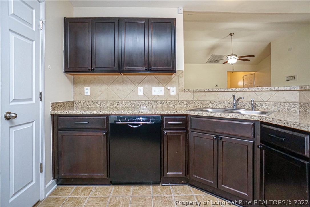 286 Cape Fear Road Raeford, NC 28376 - Photo 14 of 46 a kitchen with granite countertop stainless steel appliances a sink and cabinets