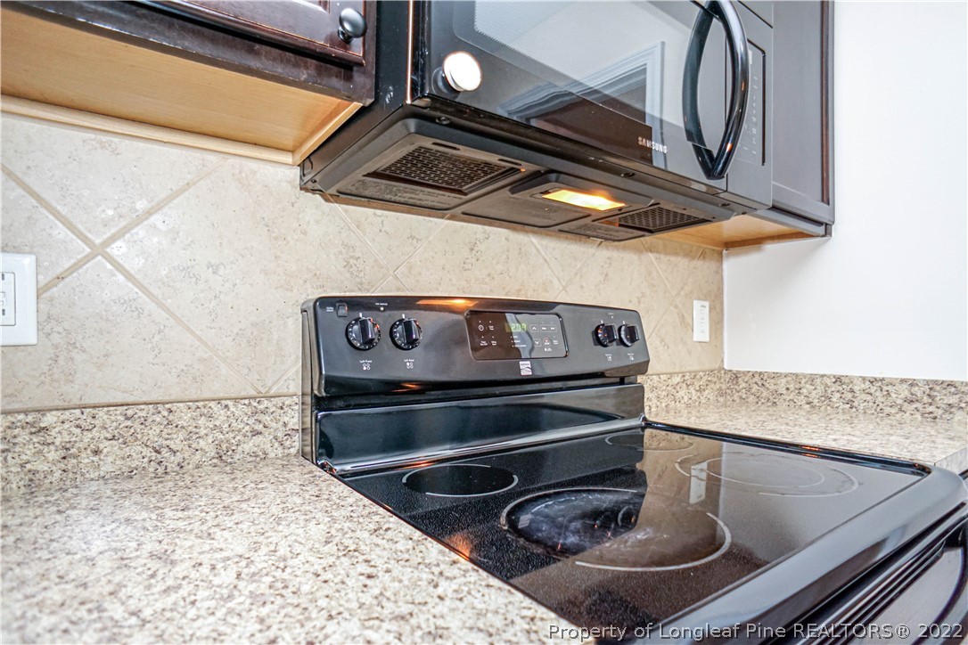 286 Cape Fear Road Raeford, NC 28376 - Photo 15 of 46 a kitchen with a stove and a microwave