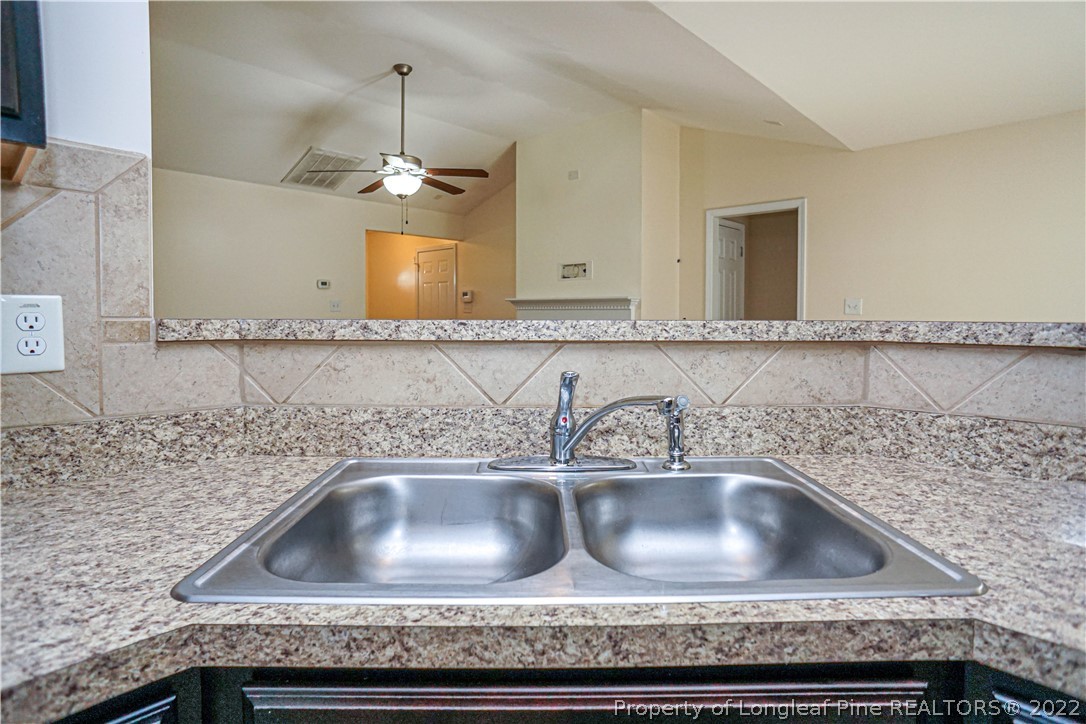 286 Cape Fear Road Raeford, NC 28376 - Photo 16 of 46 a kitchen sink with granite countertop a sink