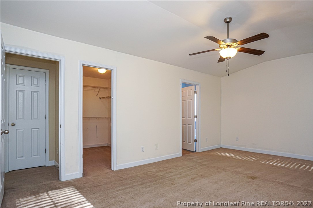 286 Cape Fear Road Raeford, NC 28376 - Photo 20 of 46 a view of a room with a ceiling fan and a bathroom