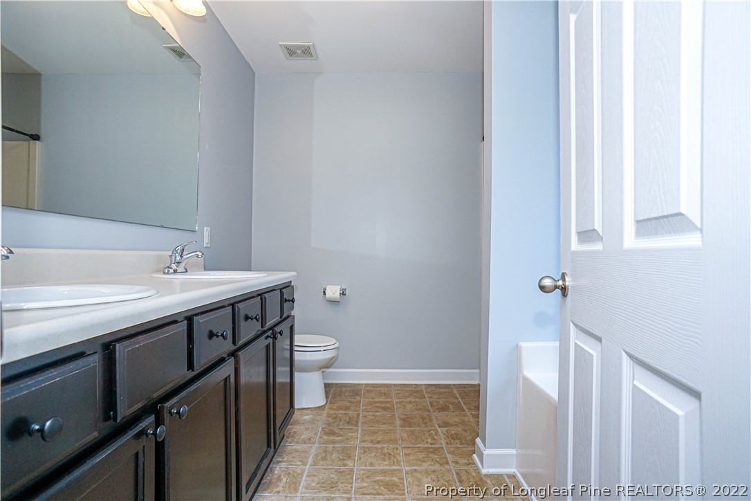 286 Cape Fear Road Raeford, NC 28376 - Photo 22 of 46 a bathroom with a sink and a mirror