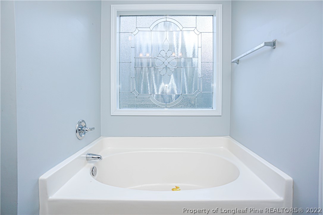 286 Cape Fear Road Raeford, NC 28376 - Photo 26 of 46 a white bath tub sitting in a bathroom next to a window