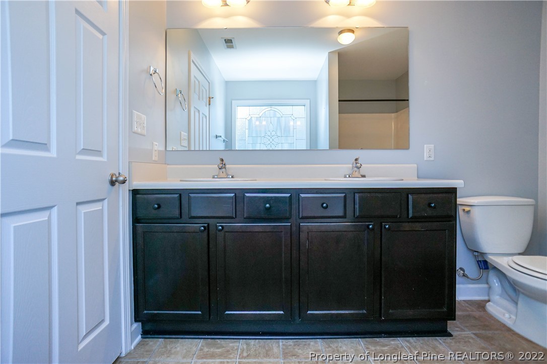 286 Cape Fear Road Raeford, NC 28376 - Photo 27 of 46 a bathroom with a sink and a mirror