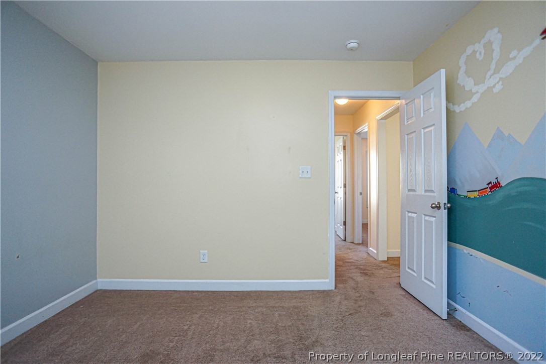 286 Cape Fear Road Raeford, NC 28376 - Photo 30 of 46 an empty room with an entryway and a window