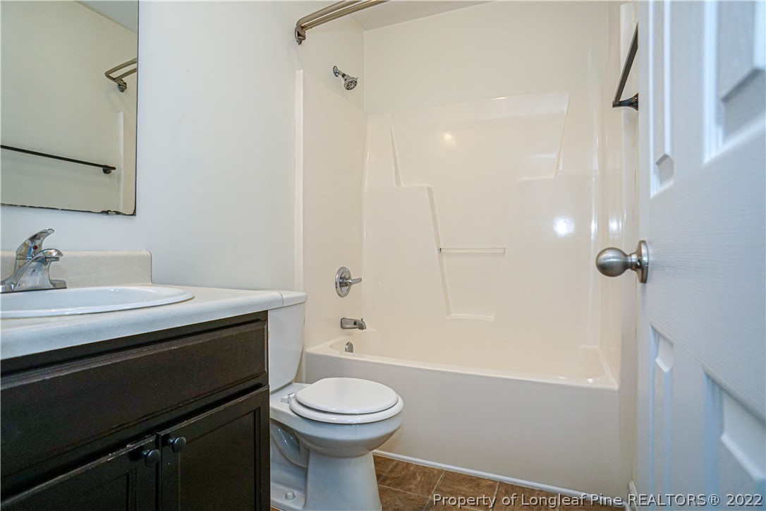 286 Cape Fear Road Raeford, NC 28376 - Photo 33 of 46 a bathroom with a sink a toilet and shower
