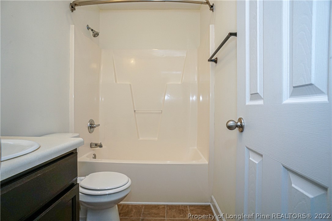 286 Cape Fear Road Raeford, NC 28376 - Photo 35 of 46 a bathroom with a sink a toilet and shower