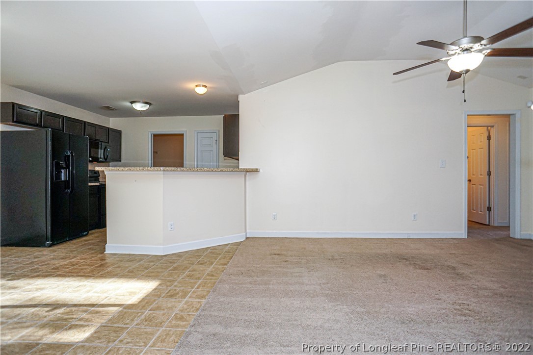 286 Cape Fear Road Raeford, NC 28376 - Photo 8 of 46 a view of a kitchen with a sink and a refrigerator