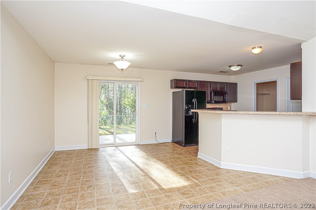 286 Cape Fear Road Raeford, NC 28376 - Photo 9 of 46 a view of a kitchen with a sink and a refrigerator