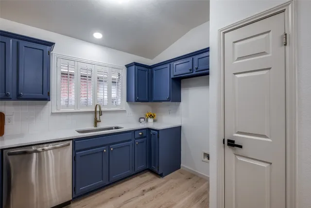 a kitchen with stainless steel appliances granite countertop wooden cabinets a sink and dishwasher
