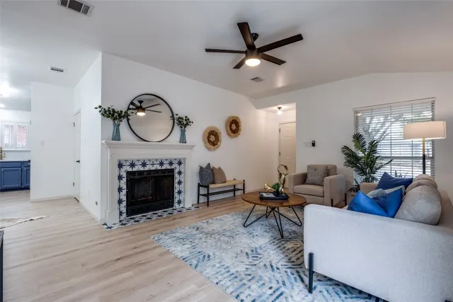 a living room with furniture and a fireplace