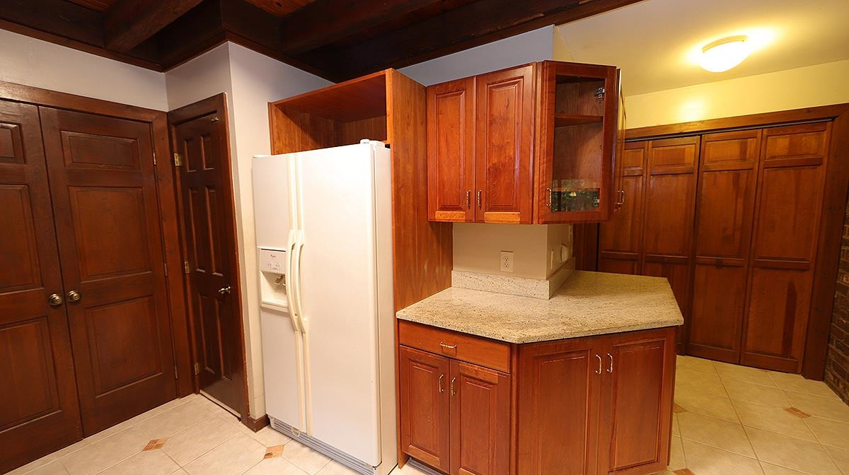 2413 Pleasant Union Church Road Raleigh, NC 27614 - Photo 8 of 30 Laundry closet to right and basement stairs to left. (lights come on automatically as you walk down) Kitchen
