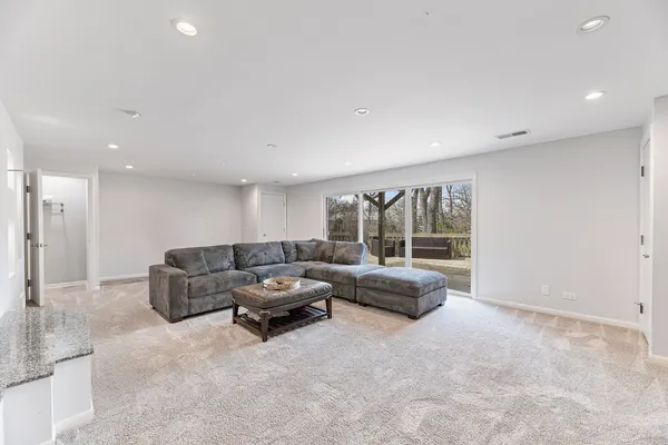 a large white kitchen with a large window