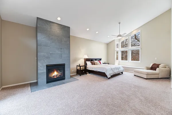 a bedroom with a large bed and a couch