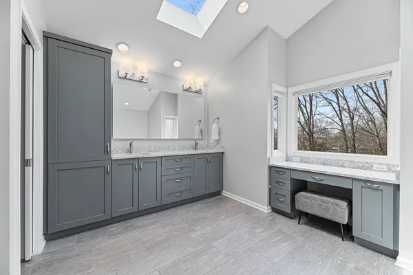 a bathroom with a bathtub and a sink