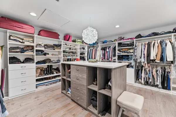 a bedroom with a bed and a desk
