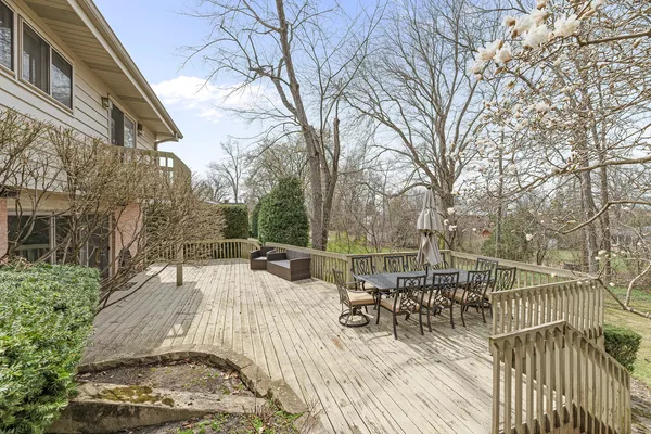 a view of a backyard with sitting area