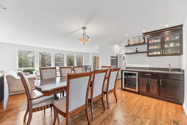 a kitchen with lots of counter top space and painting on the wall