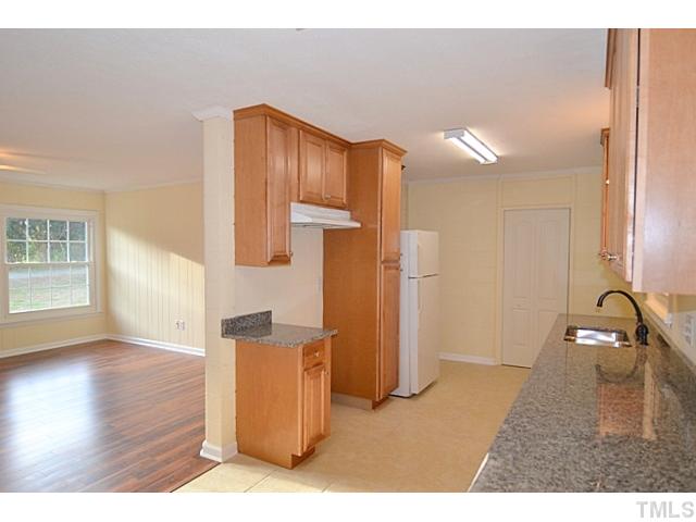 8028 Hebron Church Road Mebane, NC 27302 - Photo 6 of 25 Like New Kitchen w/ Updated Granite Counters, New Cabinets, & Modern Fixtures.