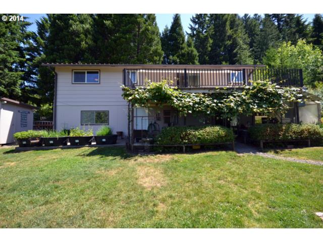 22871 South Reid Road Estacada, OR 97023 - Photo 11 of 16 a view of a house with a yard and sitting area
