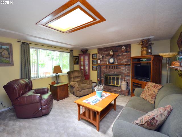 22871 South Reid Road Estacada, OR 97023 - Photo 3 of 16 a living room with furniture a rug and a large window