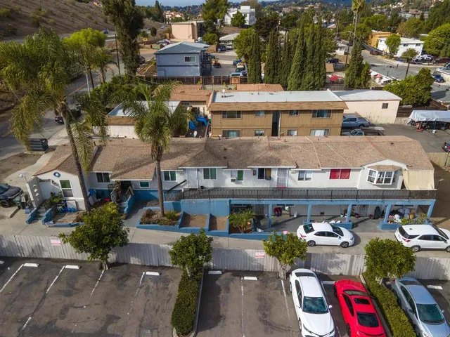 an aerial view of a house with sitting area