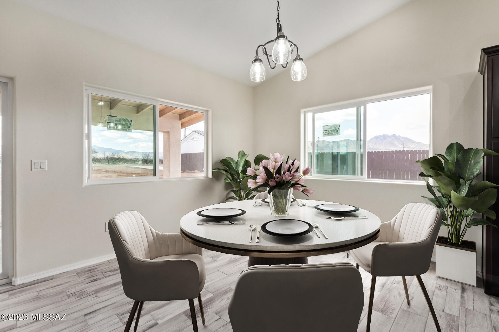 1795 Escobedo Court Rio Rico, AZ 85648 - Photo 8 of 30 a dining room with furniture a large window and wooden floor