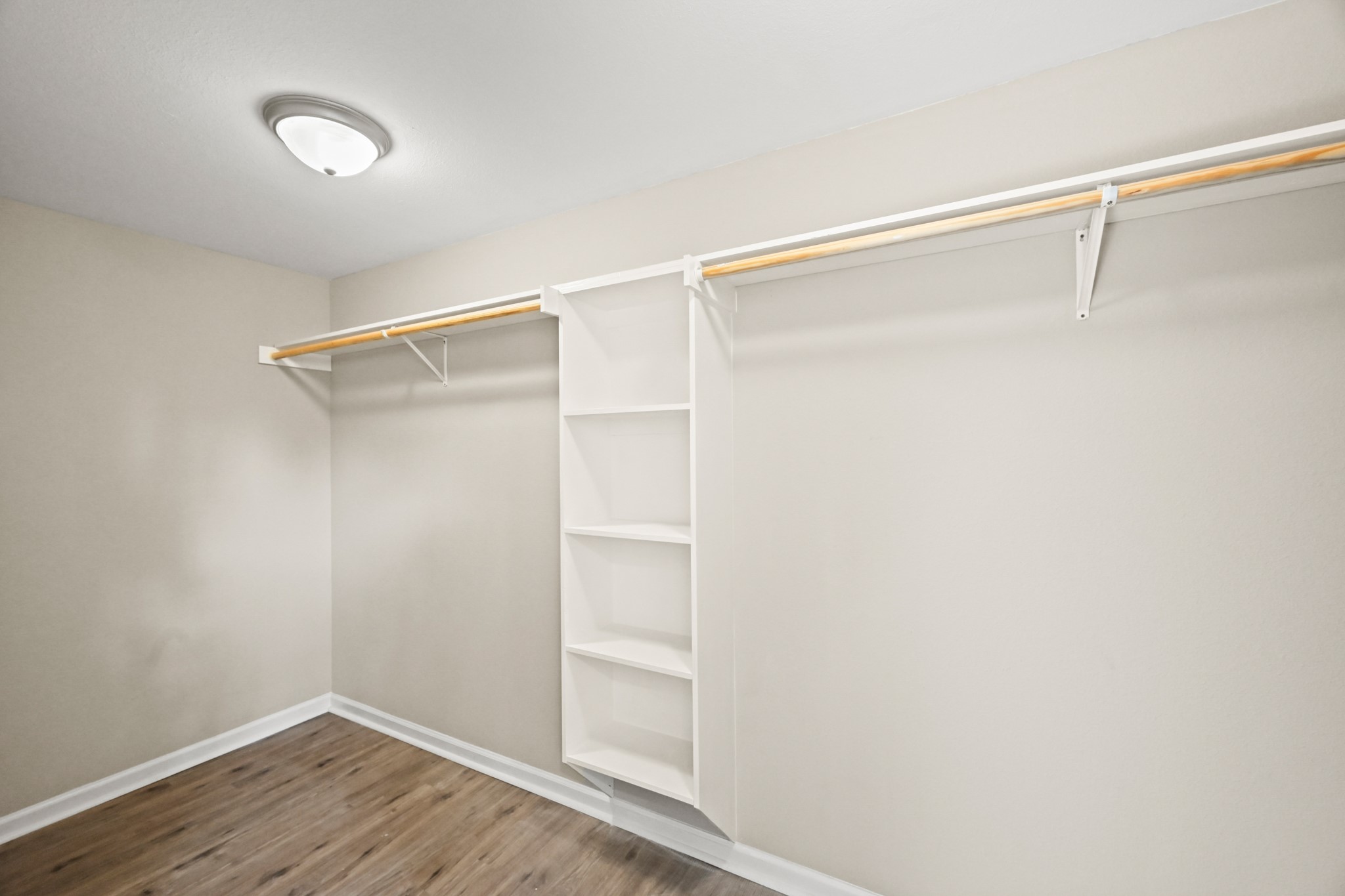 1007 Gazin Street Houston, TX 77020 - Photo 14 of 29 a view of walk in closet with empty racks