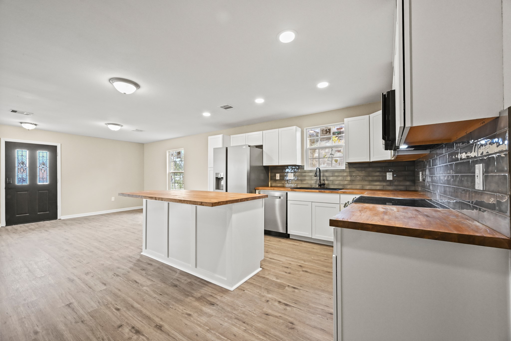 1007 Gazin Street Houston, TX 77020 - Photo 4 of 29 a kitchen with stainless steel appliances granite countertop a stove a sink and a refrigerator