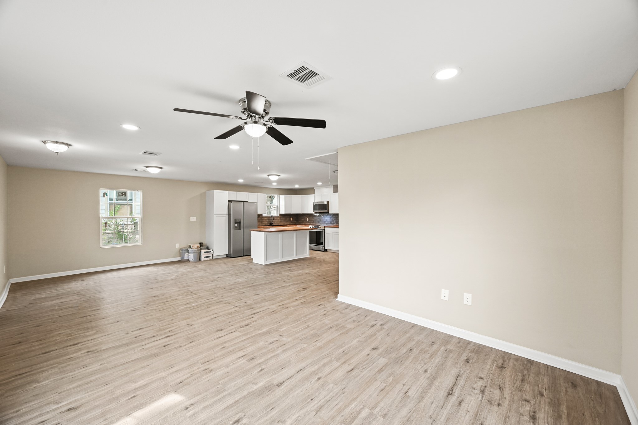 1007 Gazin Street Houston, TX 77020 - Photo 7 of 29 a view of a kitchen with a sink and wooden floor