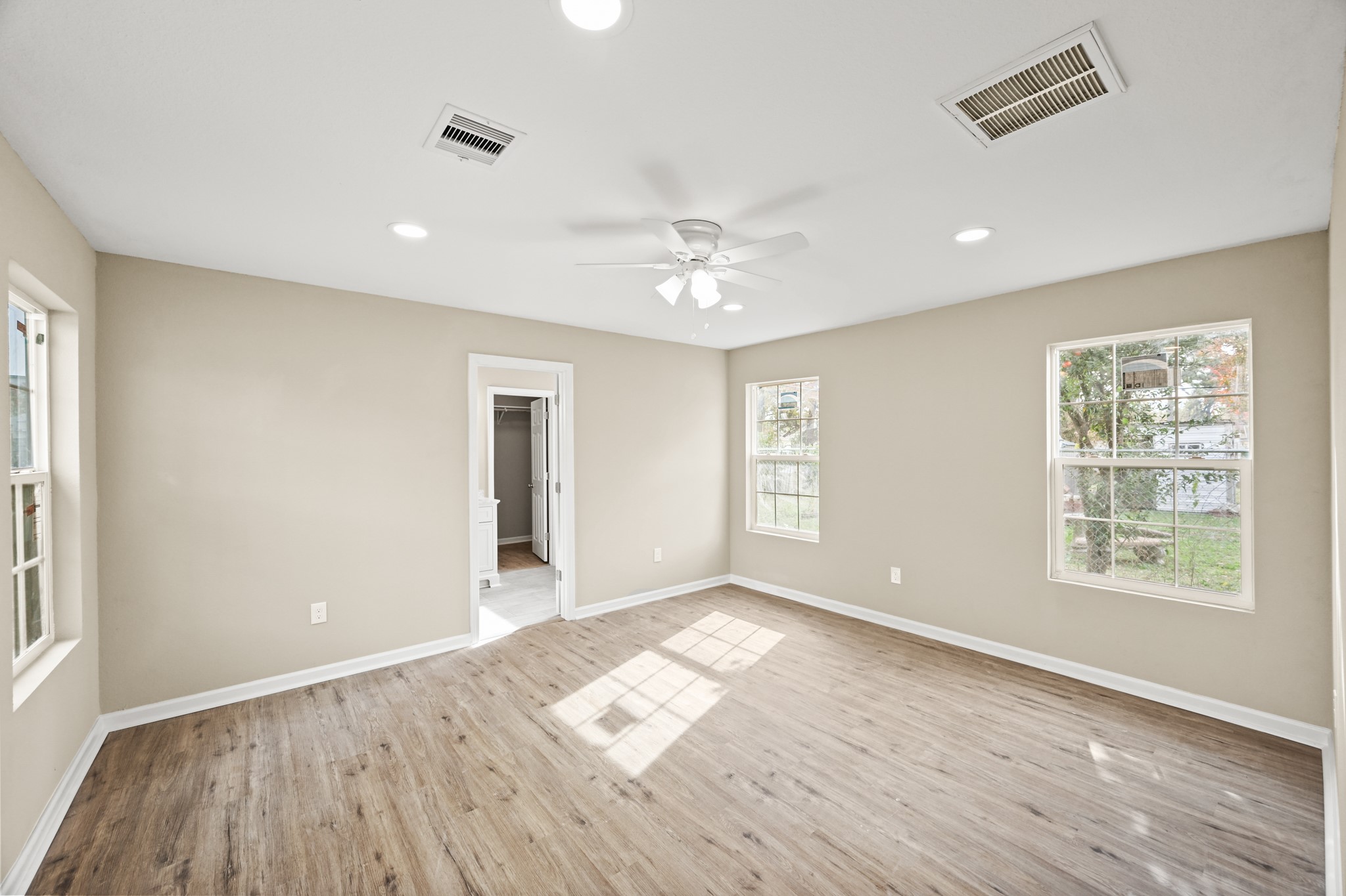 1007 Gazin Street Houston, TX 77020 - Photo 9 of 29 wooden floor in an empty room with a window