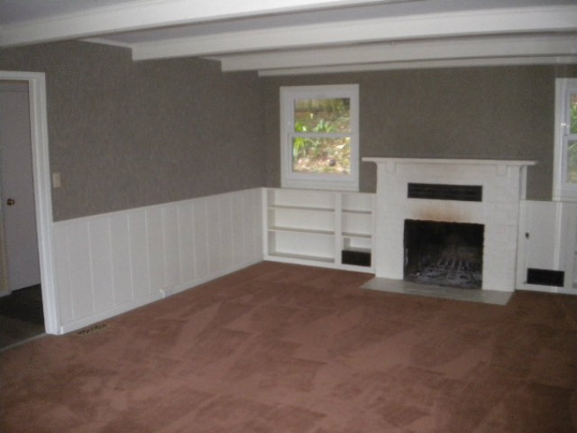 44 Ridge Way Mount Hermon, CA 95041 - Photo 11 of 12 a view of an empty room with a fireplace and a window