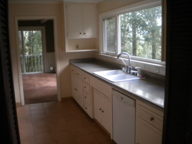 44 Ridge Way Mount Hermon, CA 95041 - Photo 10 of 12 a kitchen with granite countertop a sink window and cabinets