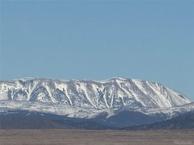 a water heater sitting on a wooden floor