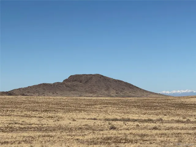 a view of ocean and a mountain