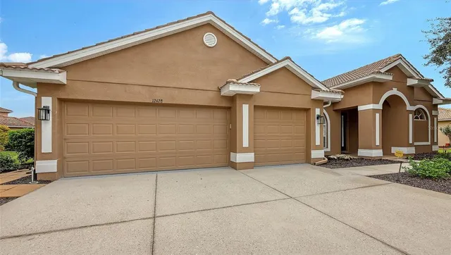a view of house and garage