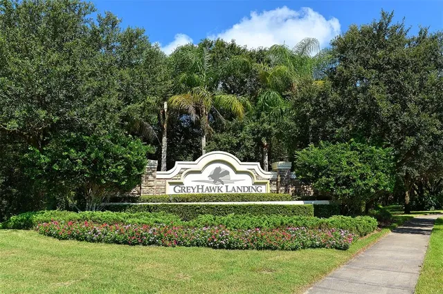 a kitchen with granite countertop stainless steel appliances sink microwave and stove