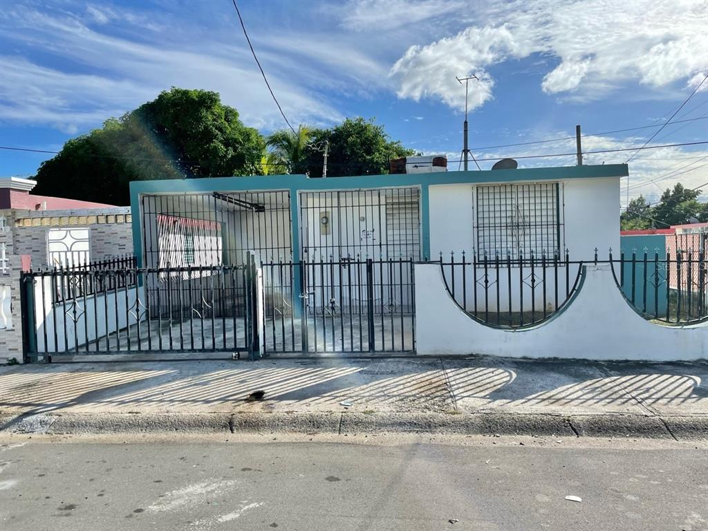4 Estancias Del Rio, Unit C1 Loiza, Loíza 00772 - Photo 1 of 1 a view of a house with a fence