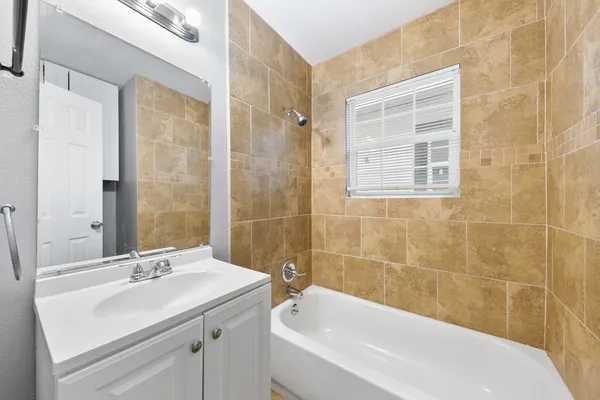 a bathroom with a sink and a bathtub