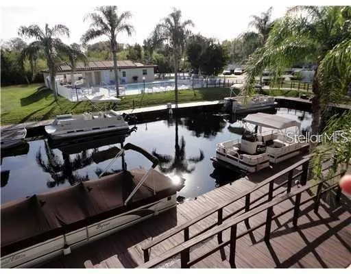 a view of a roof deck with couches and wooden floor