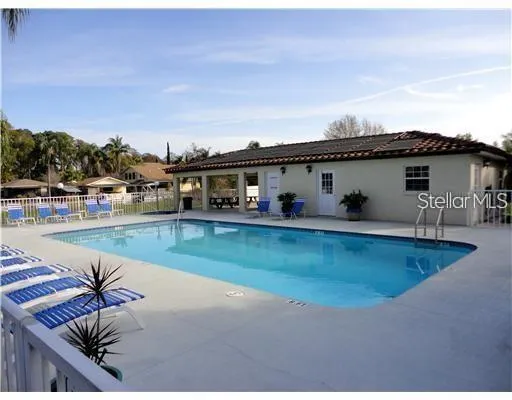 a view of swimming pool with outdoor seating