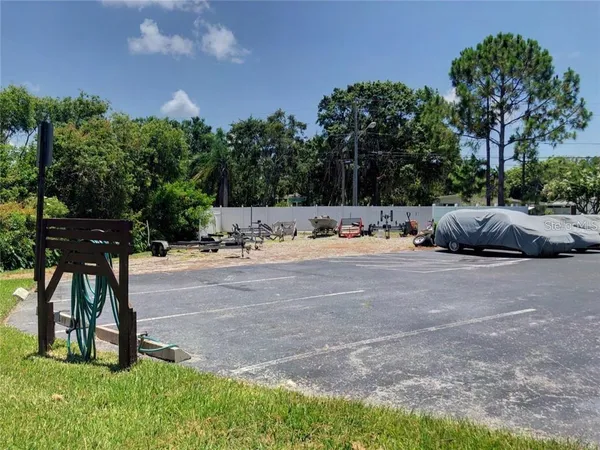 a view of backyard with outdoor seating and green space