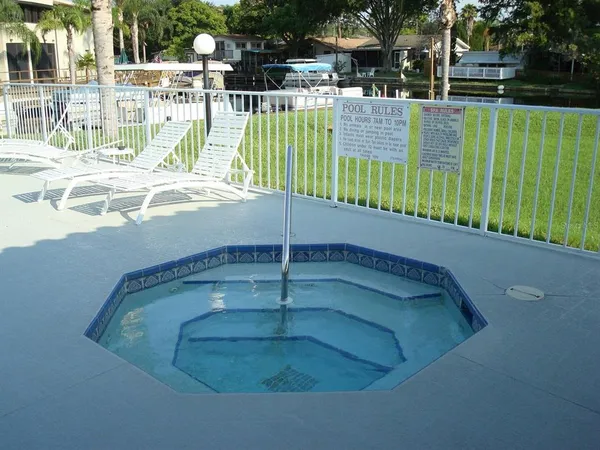 a view of a swimming pool with a patio
