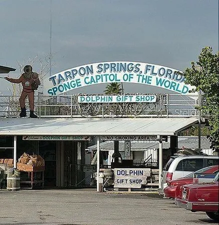 a view of a building with cars parked