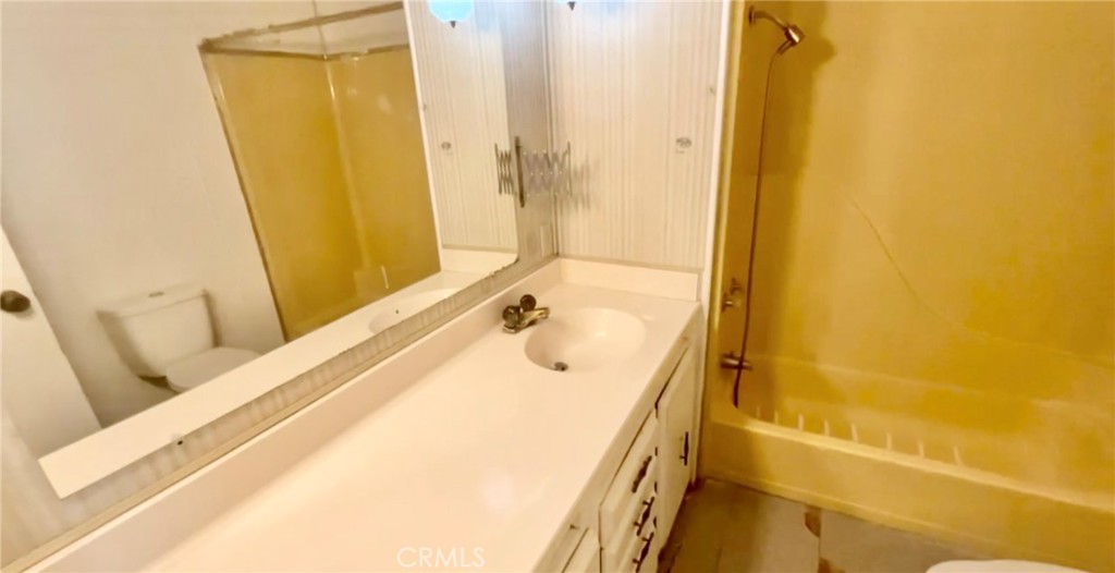 7282 Marin Street Nice, CA 95464 - Photo 64 of 69 a bathroom with a tub sink and mirror