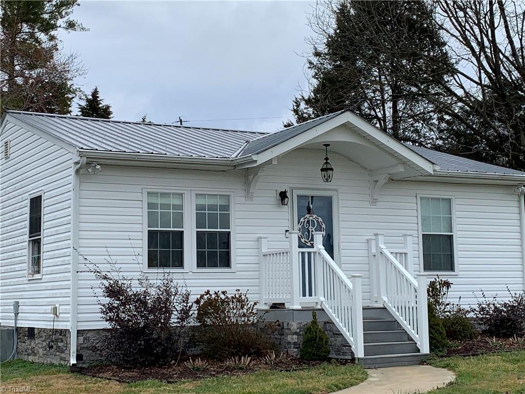 Cute home with a tin roof in the country to enjoy peace and quiet.