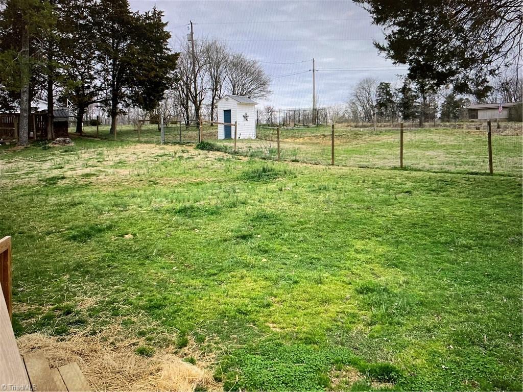 7741 Cedar Square Road Randleman, NC 27317 - Photo 3 of 18 Fenced in back yard. Lots of room for children or dogs to play.